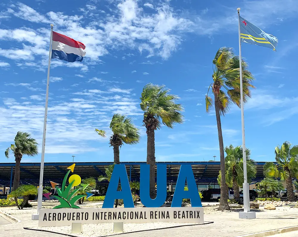 Entrance sign for Aruba’s Queen Beatrix International Airport