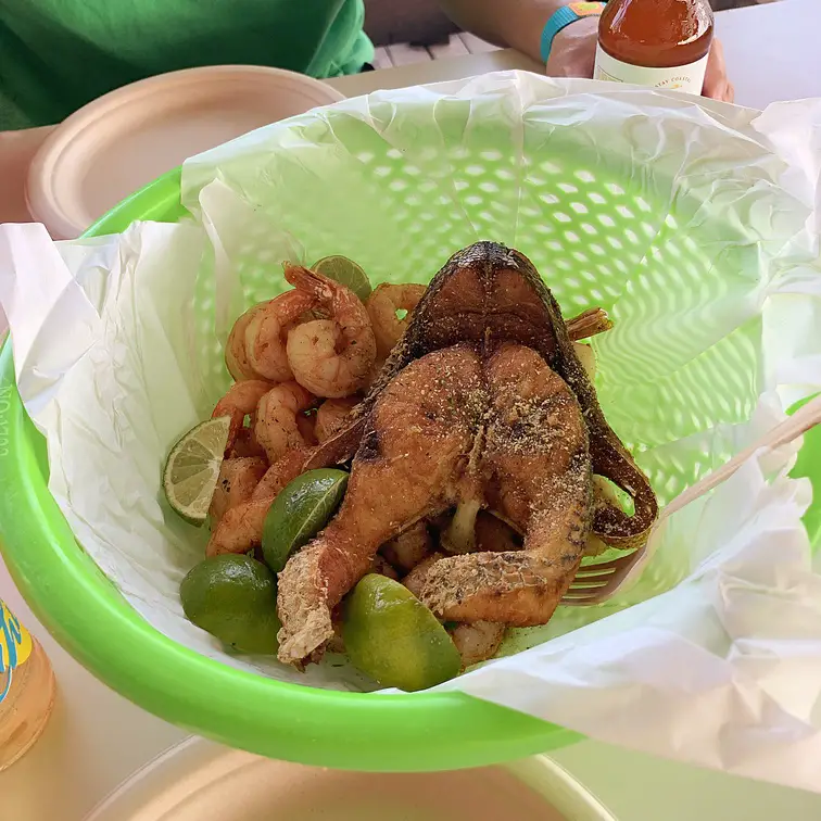 fried barracuda, shrimp, and limes at Zeerover Restaurant