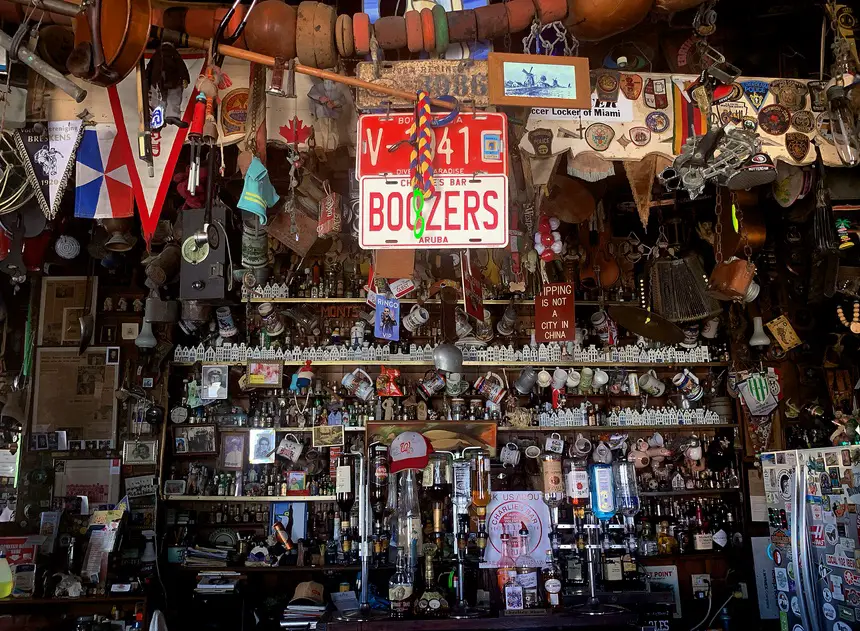 eclectic knickknacks adorning the walls and hanging from the ceiling inside Charlie’s Bar in San Nicolas, Aruba
