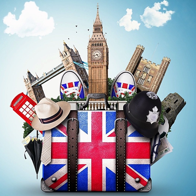 A Union Jack-print suitcase holding shoes, an umbrella, a hat, and London landmarks